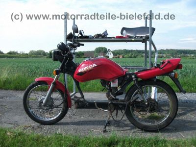 Honda_CG_125_CG125_JC27__rot_teilzerlegt_neue_Motorteile_CB_CBF_CBZ_CBX_125_1.jpg
